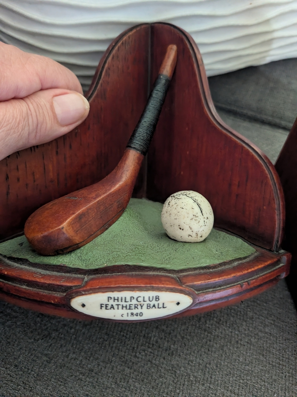 decorative bookend featuring a replica of an H. Philp "feathery" golf club
